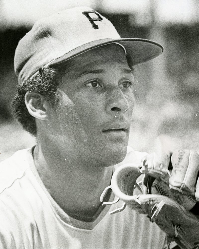 Jackie Hernández with Pirates cap and glove